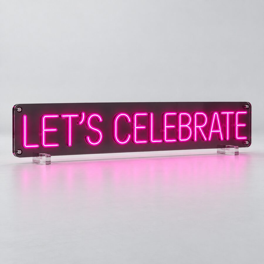 Magenta LET’S CELEBRATE neon sign with smoke acrylic backing and clear feet
